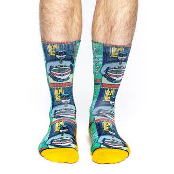These fun socks feature a 1980’s comic book version of Batman sitting at a chinese noodle shop eating a bowl of ramen noodles. The image is printed three times, and the sole, toe, and heel of the socks are yellow. The active fit socks sport elastic arch bands to contour to your feet and provide support.