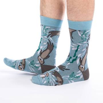 These fun socks feature some otters happily floating on the blue and white water background with sea weeds floating around them. The heel is the same brown as the otter’s fur. Spandex added to the 85% cotton blend gives the socks the perfect amount of stretch to hug your feet.