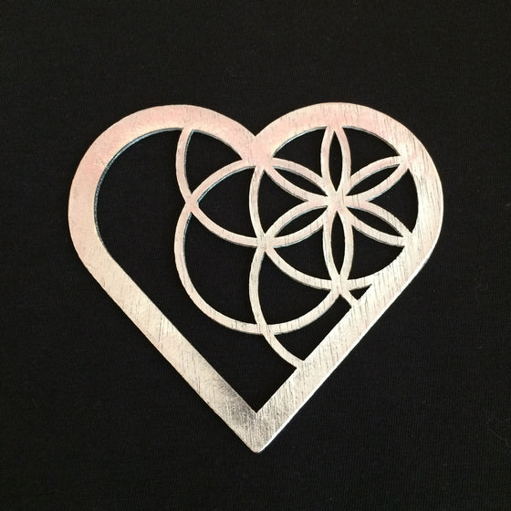 A heart outline with several circles forming a star pattern that sits in the top left portion of the heart. 