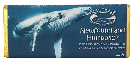 Small chocolate bar wrapped in gold foil. In a sleeve with photo of a Newfoundland Humpback whale in water.