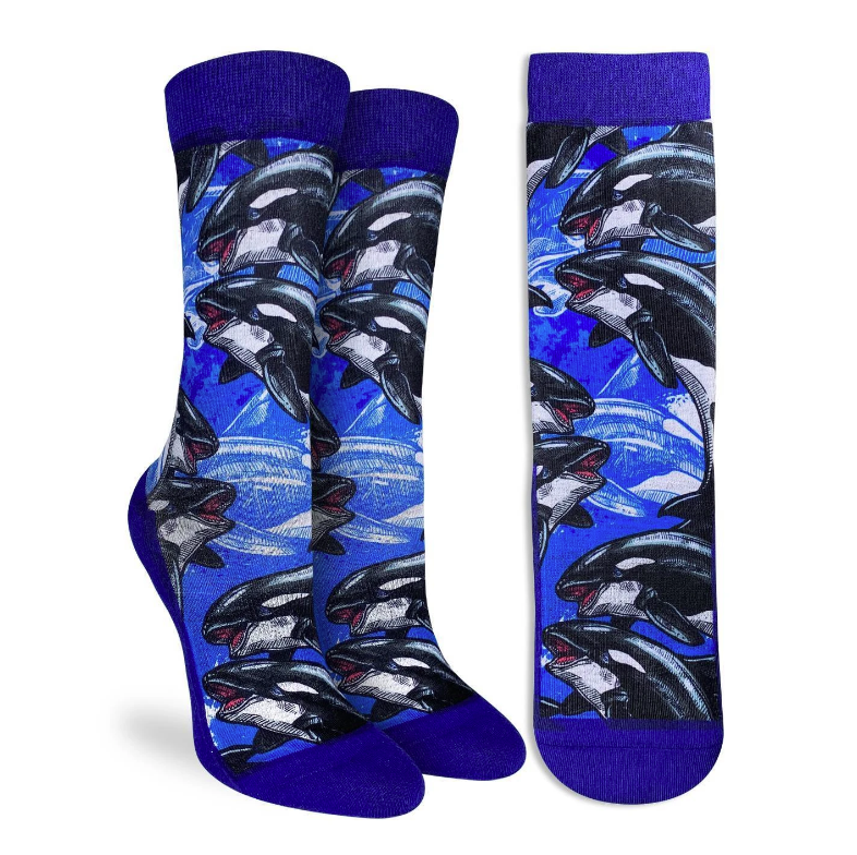 These active fit socks feature a print with several orca whales swimming around. These majestic sea creatures can now decorate your feet whether you're on or off the land. They are dark blue at the cuff and from the heel through the sole to the toe. 48% Polyester, 45% Cotton, 5% Elastic, 2% Spandex