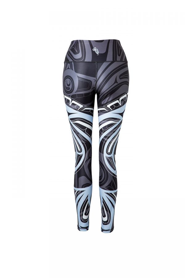 The wolf moon leggings viewed from behind, providing a partial view of the blue and white moon motif. A grey wolf’s head with bared teeth can be seen across the left hip. 