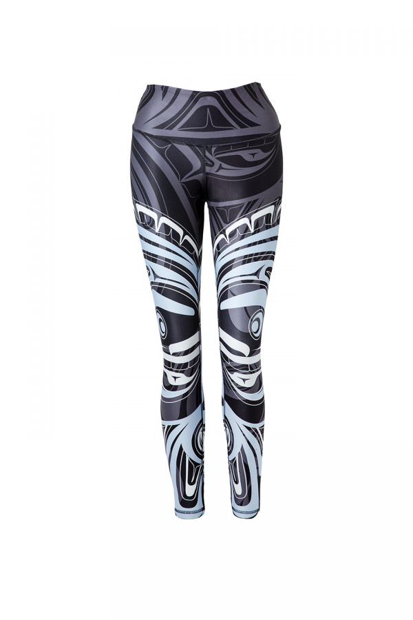 These black, grey, blue and white leggings are decorated with a Haida moon and wolf. Each leg has one large complex moon figure printed on it in blue and white. In the background is a wolf design printed subtly in grey on black.