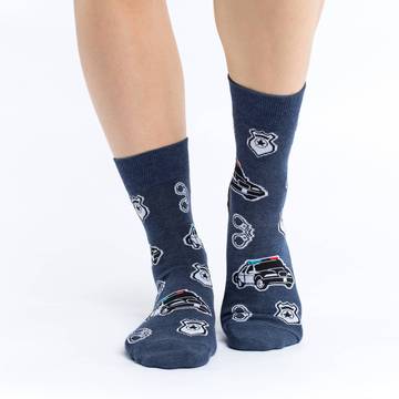 These fun socks feature police cars, badges, and handcuffs on a background of dark blue with a black heel. Spandex added to the 85% cotton blend gives the socks the perfect amount of stretch to hug your feet.