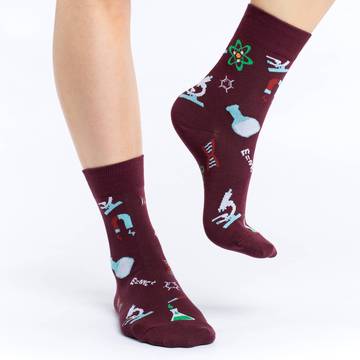These fun socks feature things that would be found in a science lab, such as a beaker of liquid, a microscope, and a DNA model, among other things. The images are on a burgundy background. Spandex added to the 85% cotton blend gives the socks the perfect amount of stretch to hug your feet.