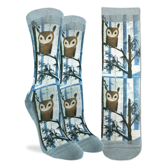 These fun socks feature an owl sitting on a snow covered tree branch, with more snowy trees in the background. The sole, toe, heel, and rim of the sock is a blue tinted grey. The active fit socks sport elastic arch bands to contour to your feet and provide support. 