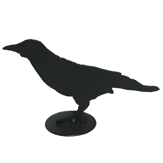 A close up of crow design F. This crow is seen in profile. It stands leaning slightly forward, eyes on a distant target. Its long straight back and tail are nearly parallel to the ground. This crow sports a small neck ruff.