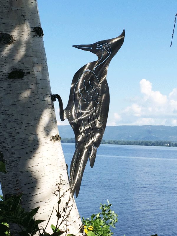 The mountable woodpecker in a brushed metal finish. This picture provides a clearer view of carved details of the woodpecker's wings and tail feathers.