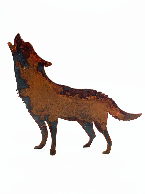 A howling wolf silhouette standing on four legs, cut from warm, weathered steel. The unique dappling of the oxidized steel makes each piece one-of-a-kind.