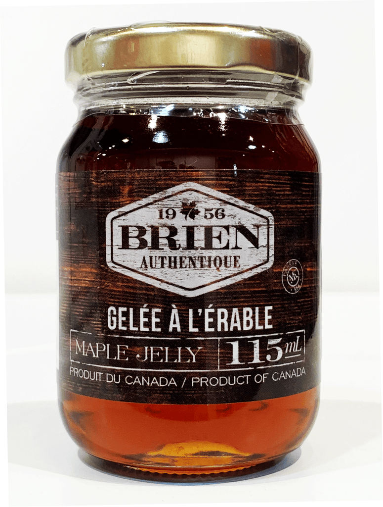 Clear jar with amber maple jelly inside.