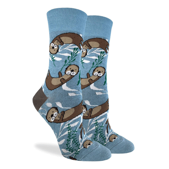These fun socks feature some otters happily floating on the blue and white water background with sea weeds floating around them. The heel is the same brown as the otter’s fur. Spandex added to the 85% cotton blend gives the socks the perfect amount of stretch to hug your feet.