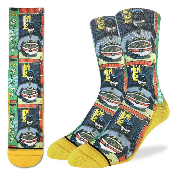 These fun socks feature a 1980’s comic book version of Batman sitting at a chinese noodle shop eating a bowl of ramen noodles. The image is printed three times, and the sole, toe, and heel of the socks are yellow. The active fit socks sport elastic arch bands to contour to your feet and provide support.