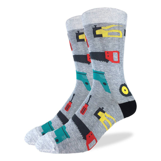 These fun socks feature hand tools such as a hand saw, staple gun, screw driver, cordless drill, pliers, a measuring tape, and a paint roller, on a grey speckled background with lighter grey toe and rim, and black heel. Spandex added to the 85% cotton blend gives the socks the perfect amount of stretch to hug your feet.
