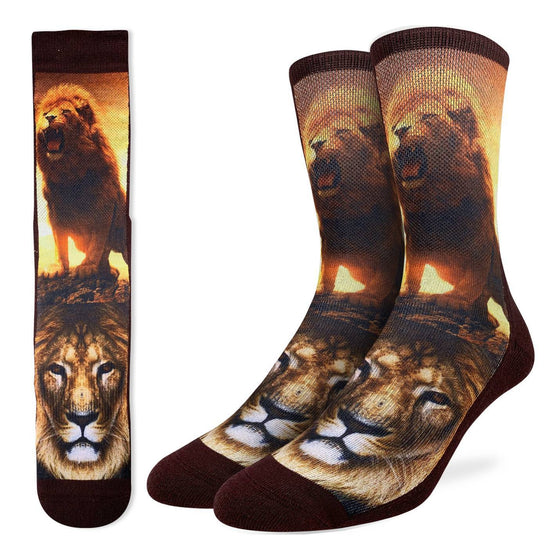 These fun socks feature the close up of an african lion, and a full body shot of a lion roaring with a beautiful orange sunset behind. The sole, heel, toe, rim, and back of the sock are brown. The active fit socks sport elastic arch bands to contour to your feet and provide support.