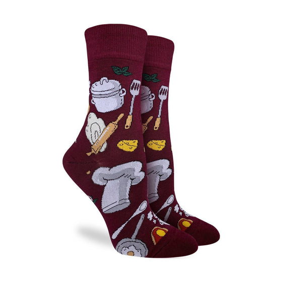 These fun socks feature items every chef needs, such a spatula, a pot, a wedge of cheese, and a chef’s hat. These items are on a deep burgundy background. Spandex added to the 85% cotton blend gives the socks the perfect amount of stretch to hug your feet.