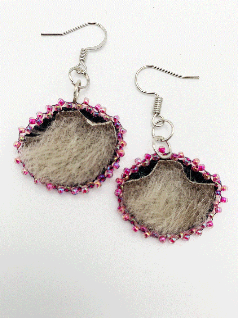 grey seal skin, Inuit ulu shaped drop earrings with pink beads around the border.