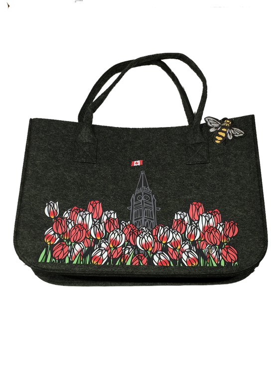 A large charcoal felt tote bag printed with the Parliament building and Maple Leaf tulips.