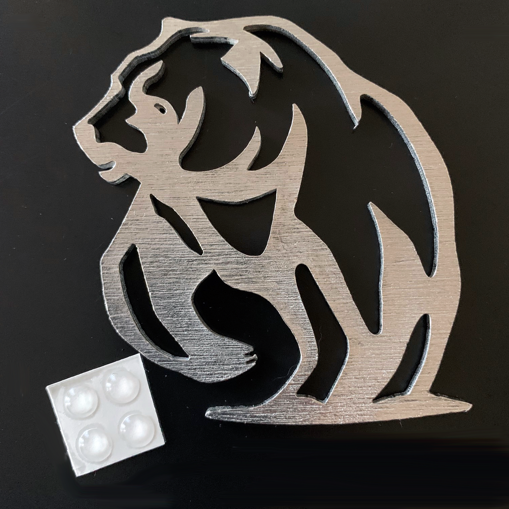 The bear ornament as a coaster with four rubber dots that stick to the back to prevent slipping and scratching. 