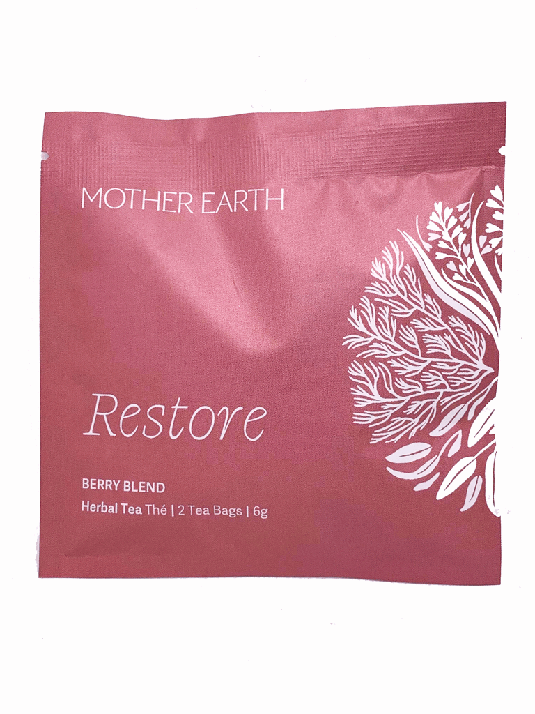 Red/pink square shaped sachet. Has text "Mother Earth" at the top and "Restore" at the bottom.