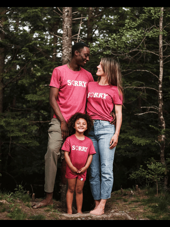 A red shirt with "Sorry" written in the center. The letters are white and in all capitals. The O in sorry is a maple leaf outline. Underneath the Y in small letters is the brand name.