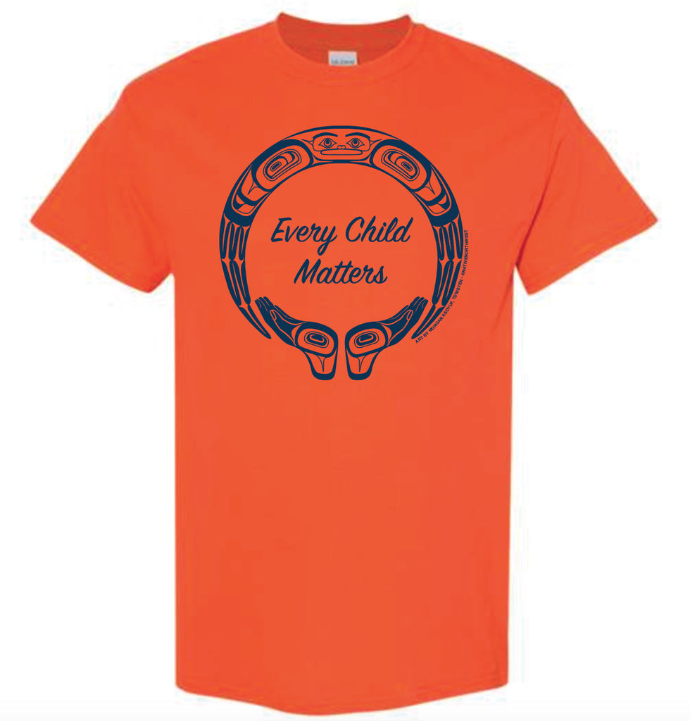 An orange shirt. In the middle is an outline of a circle with indigenous designs. At the bottom of the circle are two hands with the palms facing up. In the middle of the circle is written "Every Child Matters" in cursive font. The designs and text are in purple.