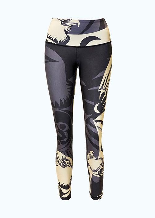 These black, grey and gold leggings are decorated with a stylized eagle motif repeated in several places across the leggings. The eagle has an intense stare and hooked beak. One gold eagle encircles the waist. There is a large grey eagle on the right leg whose wings extend around the entire leggings. Two more gold eagles stretch their wings up the left and right legs.