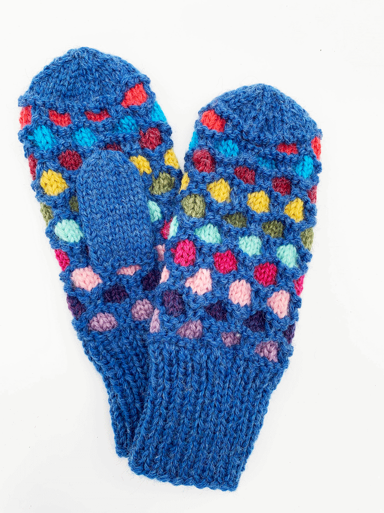 A blue pair of knit mittens with colourful circles going around the mittens. Colours consist of purple, dark purple, light pink, pink, light blue, green, yellow, red, blue, and coral. No circles on both ends of the mittens.