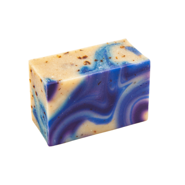 Canadian Saskatoon Berry bar of soap. Soap is yellow, blue and dark purple, with brown spots. Made in Alberta.