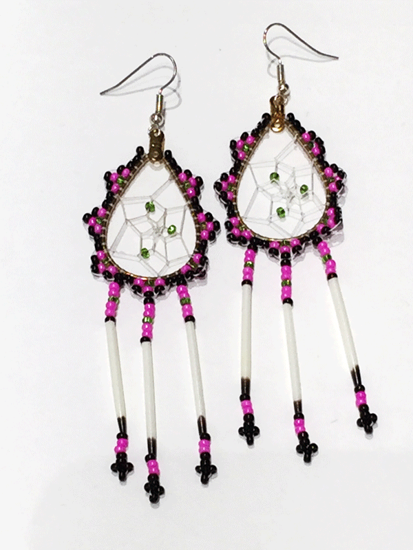 A pair of porcupine quill earrings. The hanging earrings are a tear drop shape hoop with dream catcher style weaving on the inside with green beads woven into it. Black, pink, and green beads are woven along the outside of the hoop and hanging off of the bottom are three strands with pink, green, and black beads, then a piece of porcupine quill, with more pink and black beads at the end.