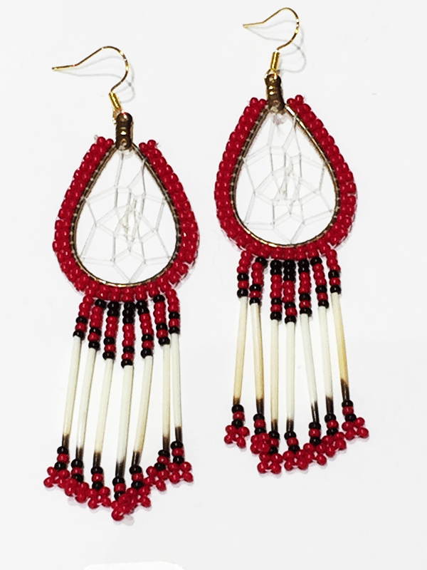 A pair of porcupine quill earrings. The hanging earrings are a tear drop shape hoop with dream catcher style weaving on the inside. Red beads are woven along the outside of the hoop and hanging off of the bottom are seven strands with red and black beads, then a piece of porcupine quill, with more red and black beads at the end.