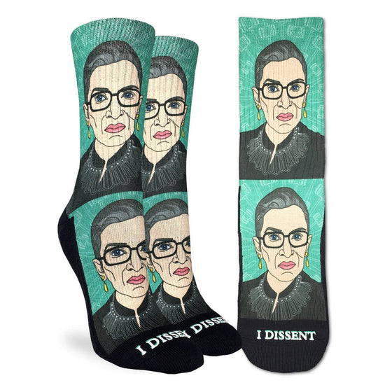 These fun socks feature a cartoon image of the famous court judge Ruth Bader Ginsberg with a teal background printed twice, with the words “I DISSENT” written underneath. The sole, toe, and heel are black. The active fit socks sport elastic arch bands to contour to your feet and provide support. 