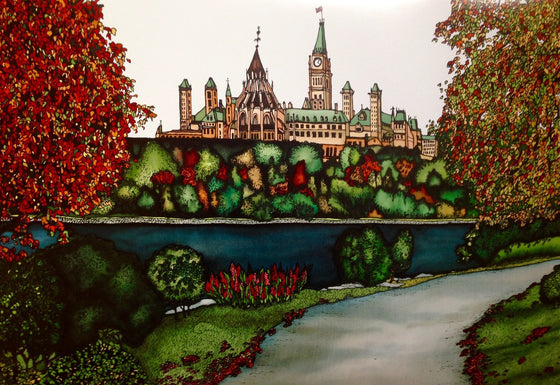 This print shows the Parliament building from across the Ottawa River. The river is dark blue and lined with trees, some of which are beginning to show their autumn colours. Curving up from the bottom to the right of the picture is a paved footpath. This print recreates the rich watercolours of the original painting.
