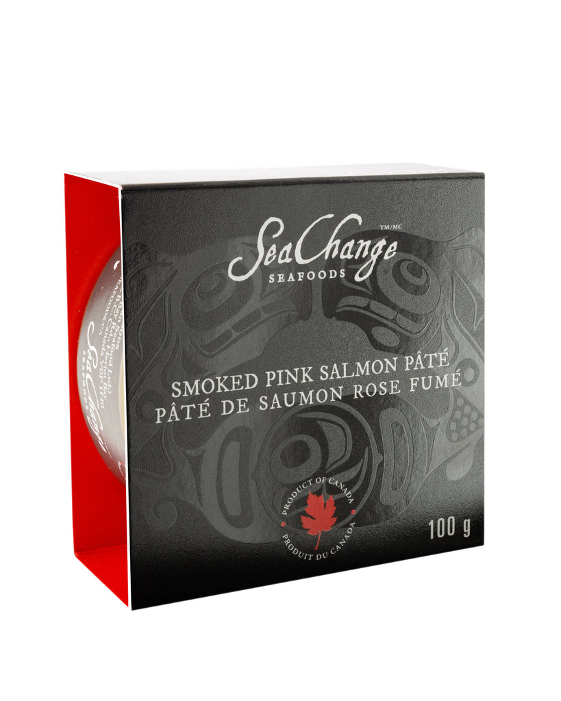Black aluminum tin featuring the Haida art of the Canadian pacific salmon by artist Don Yeomans. Tin is in partially enclosed black box that has openings on the right and left side to allow the tin to slide in and out. 