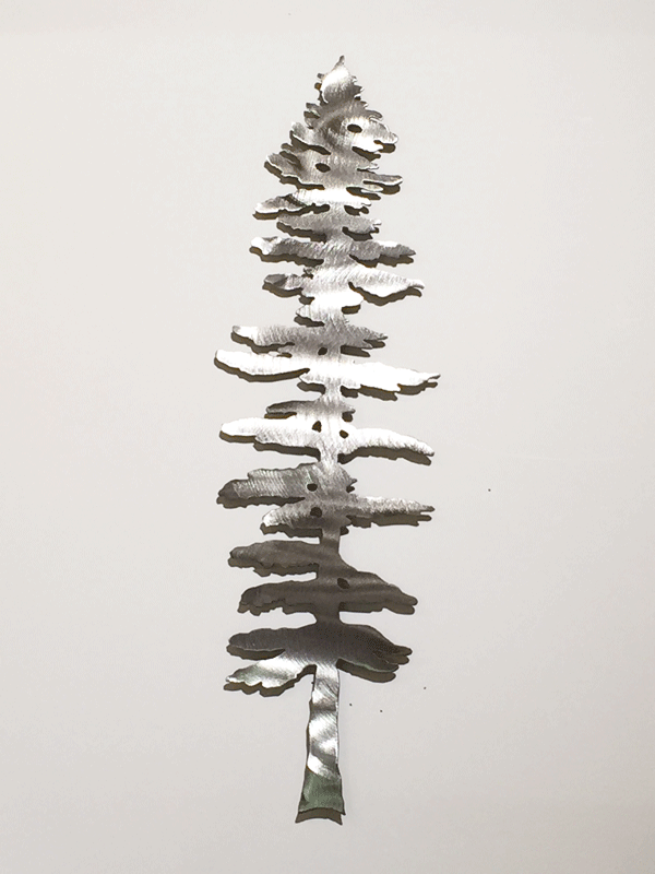 A lone brushed metal Sitka pine sculpture.