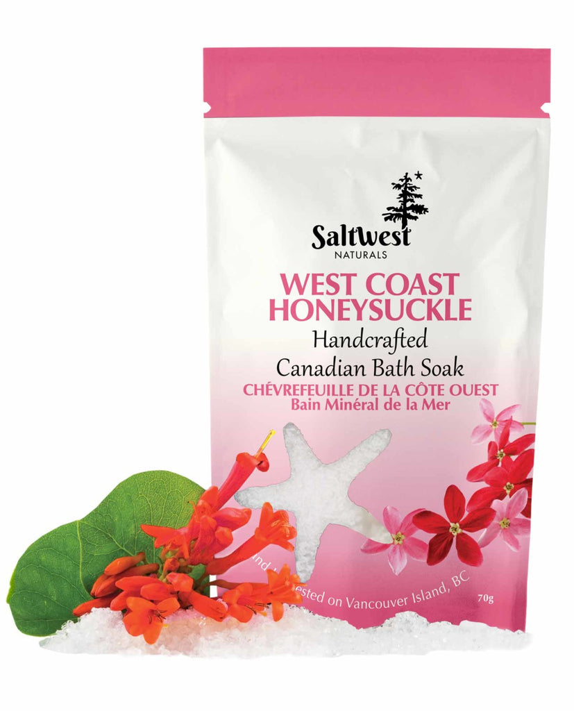 70 grams of West Coast Honeysuckle bath soak in a white and pink standing bag. 
