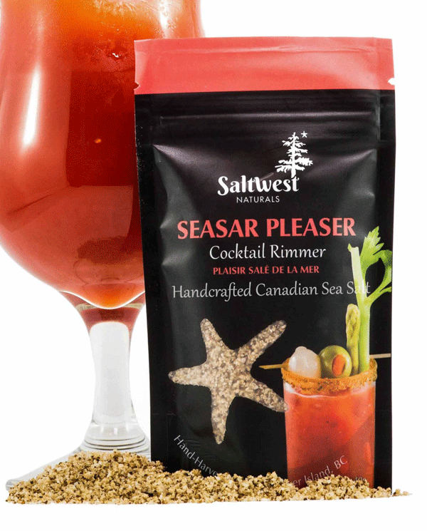 45g of a Caesar Pleaser Sea Salt. Salt is in a black standing bag, with a picture of a Caesar cocktail with some celery and olives on it. The salt is rimmed around the cup. There is also a transparent cutout of a starfish.