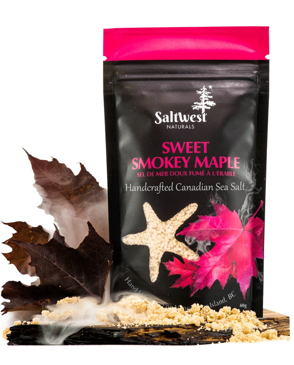 45g of Sweet Smokey Maple Sea Salt. Salt is in a black standing bag, with a picture of two red maple leaves with smoke coming out of them. There is also a transparent cutout of a starfish.