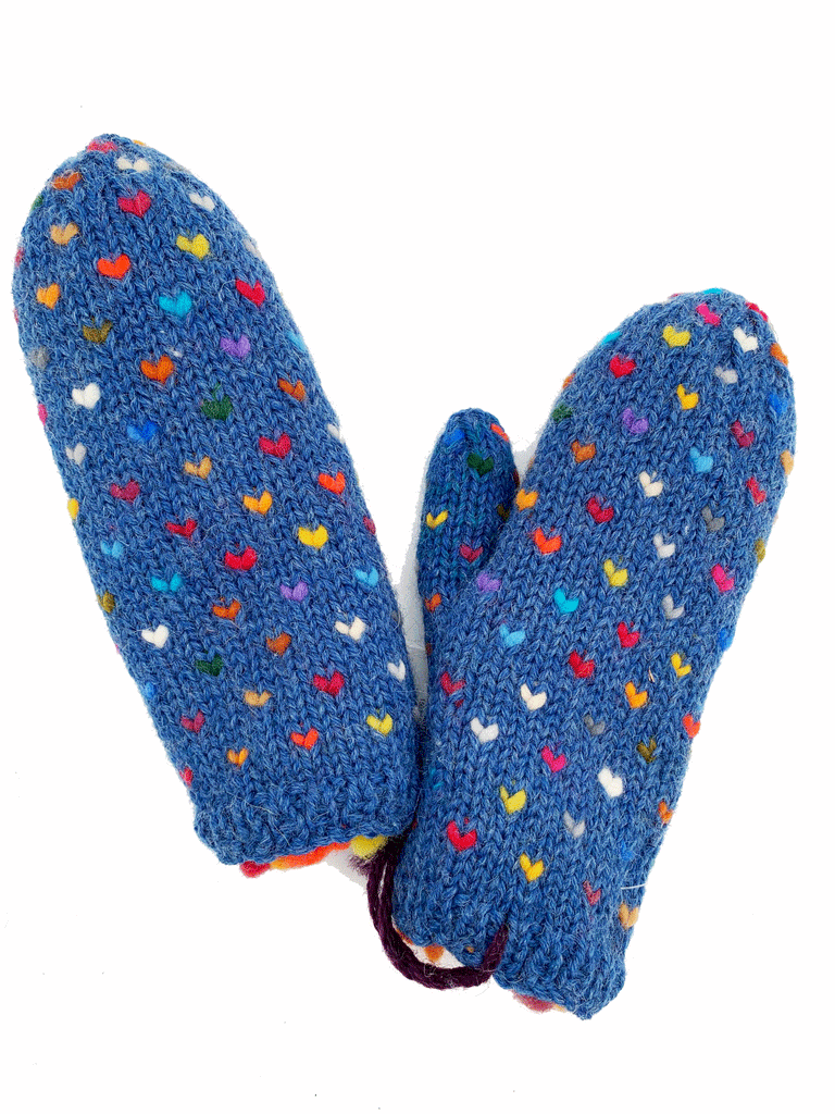 A blue pair of knit mittens with small colourful hearts. Colours consist of red, white, blue, yellow, orange, purple, green, and grey.