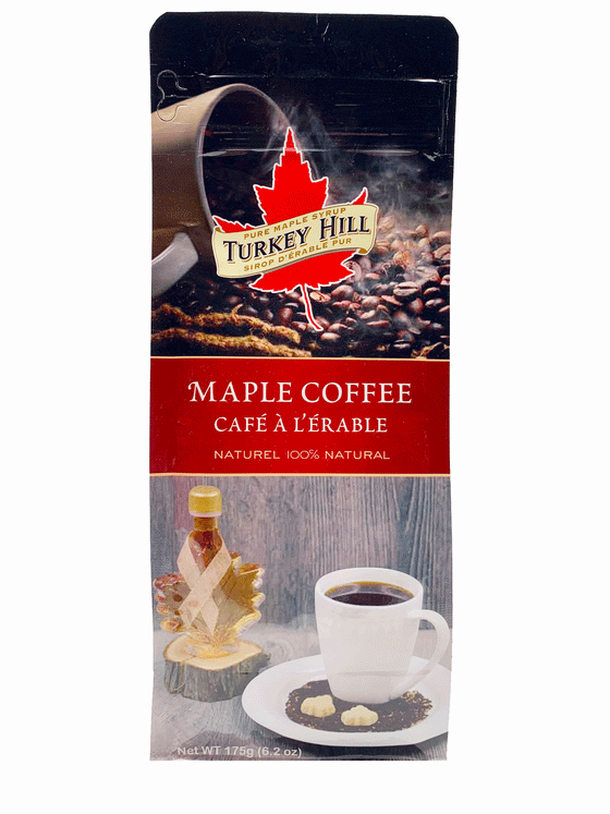 Resealable plastic pouch.  2 photos on pouch, one a picture of a coffee cup filled with steaming hot coffee beans spilt over. The other a bottle of maple syrup on a circular wooden plank in the background and a steaming hot cup of coffee in the foreground