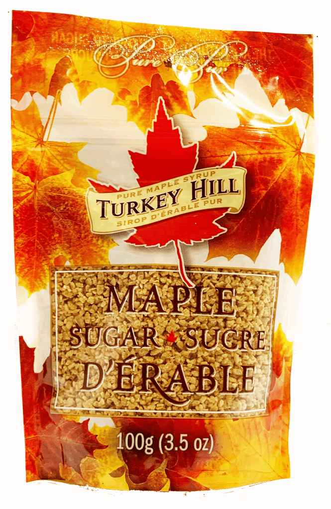 Coarse maple sugar in a resealable pouch decorated with orange sugar maple leaves.